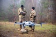 U.S. Army Sgt. Anthony Karl (left) and Staff Sgt. Jacob Owens, assigned to the 1st Engineer Battalion, 1st Brigade Combat Team, 1st Infantry Division, test fly the Skydio X10 during the U.S. Army Europe and Africa Best Drone Warfighter Competition in the Grafenwoehr Training Area, Germany, Dec. 10, 2025. The competition assesses unmanned aerial systems operator capabilities from the U.S., Spain and Italy, and reinforces the U.S. Army's commitment to innovation and readiness, and builds esprit des corps and camaraderie. (U.S. Army photo by Sgt. Collin Mackall)