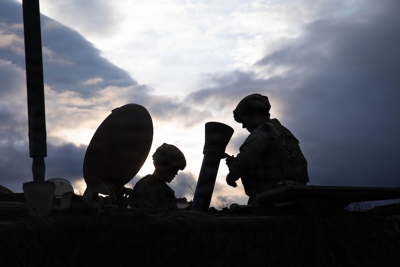 U.S. Army Spc. Miguel Amason, a mortar gunner, and Spc. Christopher Klapkowski, an assistant mortar gunner, both assigned to 1st Battalion, 16th Infantry Regiment, disassemble the M120 Mortar at the conclusion of a fire mission to conceal their firing positions on Novo Selo Training Area, Bulgaria, Dec. 8, 2025. 1st Battalion, 16th Infantry Regiment strengthens V Corps’ posture of persistent presence as they execute live fire exercises in Bulgaria– reassuring Allies, deterring aggression, and reinforcing the U.S. commitment to collective defense. (U.S. Army photo by Sgt. Adel Pacheco Alvarez) .