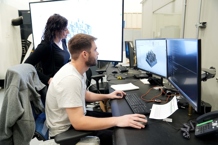 man and women working on a computer