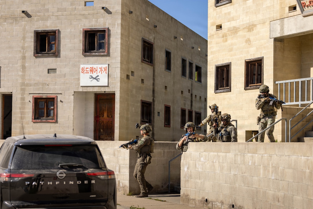 U.S. Marines with the Special Reaction Team, police officers with the San Diego County Sheriff’s Department Special Weapons and Tactics team, the Escondido Police Department SWAT team, special agents with the United States Secret Service Counter Assault Tactical Team, and the Naval Criminal Investigative Service Regional Enforcement Action Capabilities Team participate in an integrated joint training exercise at Marine Corps Base Camp Pendleton, Calif., Jan. 28, 2026. The training focuses on enhancing interagency coordination by familiarizing participants with each tactical team’s standard operating procedures and conducting practical application drills simulating real-world scenarios to increase overall proficiency among participating agencies. (U.S. Marine Corps photo by Lance Cpl. Adrian Estrada)