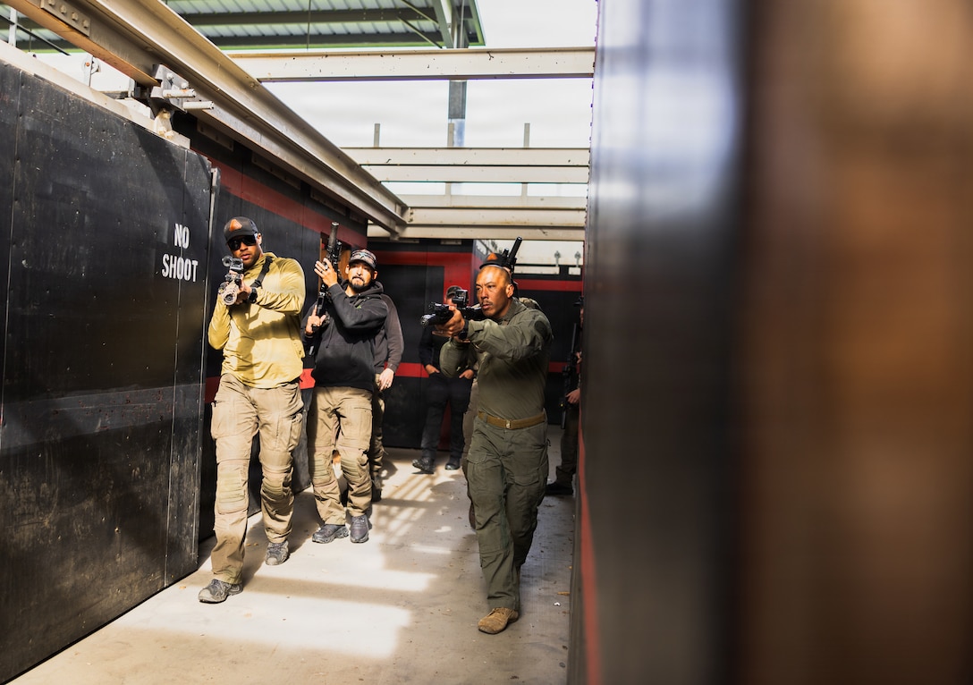 U.S. Marines with the Special Reaction Team, police officers with the San Diego County Sheriff's Department Special Weapons and Tactics team, the Escondido Police Department SWAT, special agents with the United States Secret Service Counter Assault Tactical Team, and the Naval Criminal Investigative Service Regional Enforcement Action Capabilities Team participate in an integrated joint training exercise at Marine Corps Base Camp Pendleton, Calif., Jan. 28, 2026. The exercise focuses on enhancing interagency coordination by familiarizing participants with each team’s standard operating procedures and includes practical application drills simulating real-world scenarios to increase overall proficiency among participating agencies. (U.S. Marine Corps photo by Sgt. Edgar Rafael).
