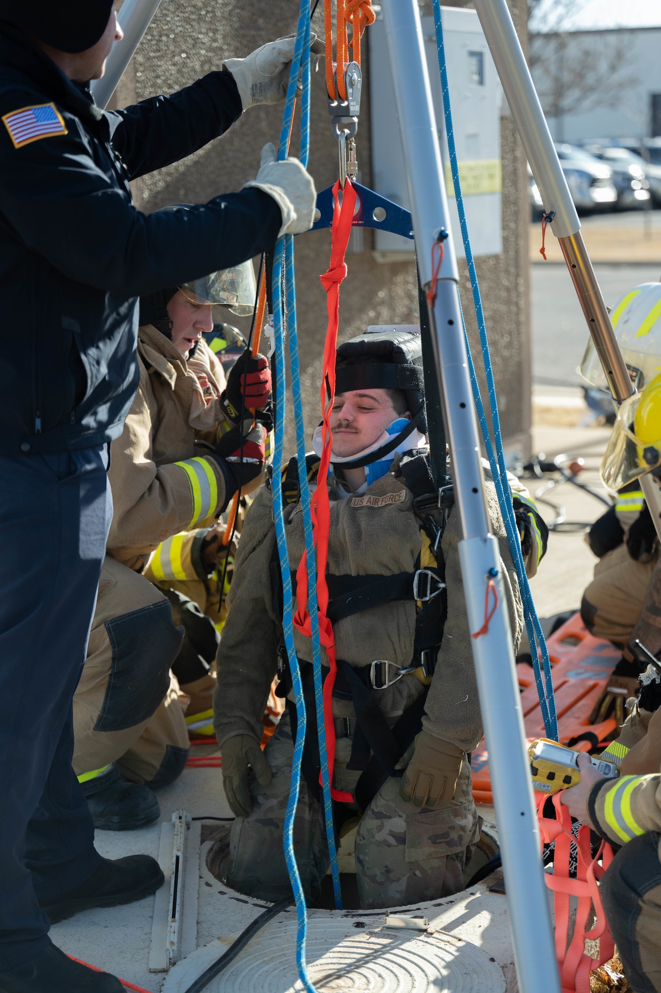 U.S. Air Force Airman 1st Class Malakai Polensky, 97th Civil Engineer Squadron water and fuel systems maintenance journeyman, is lifted out of a confined space at Altus Air Force Base (AFB), Oklahoma, Jan. 20, 2026. During the training, members of Altus AFB Fire Department were evaluated on their atmospheric monitoring. (U.S. Air Force photo by Airman 1st Class Emma Wright)