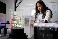 Manya Yellepeddy, U.S. Naval Research Laboratory (NRL) intern, adjusts an aperture on an event-based camera in Washington, D.C., Aug. 7, 2025. Yellepeddy participated in NRL’s Science and Engineering Apprentice Program where students work alongside researchers, attend program seminars, and deliver research presentations while exploring careers in science and technology. (U.S. Navy photo by Sarah Peterson)