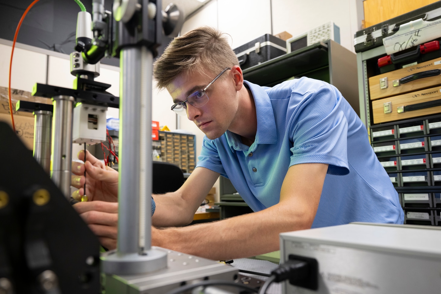 Justin Hagen, U.S. Naval Research Laboratory (NRL) intern, calibrates a piezoelectric driven flexible surface membrane in Washington, D.C., Aug. 7, 2025. Hagen participated in NRL’s Pathways Internship Program where students from a wide variety of educational institutions can explore federal careers and work in agencies while attending school. (U.S. Navy photo by Sarah Peterson) RELEASED