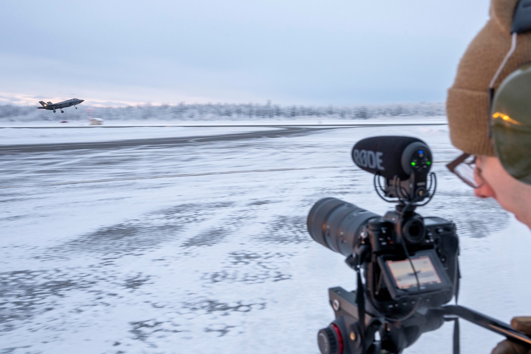 U.S. Air Force Senior Airman Colin Perkins, 354th Fighter Wing Public Affairs journeyman, records a video of an F-35A Lightning II taking off at Eielson Air Force Base, Jan. 15, 2026.