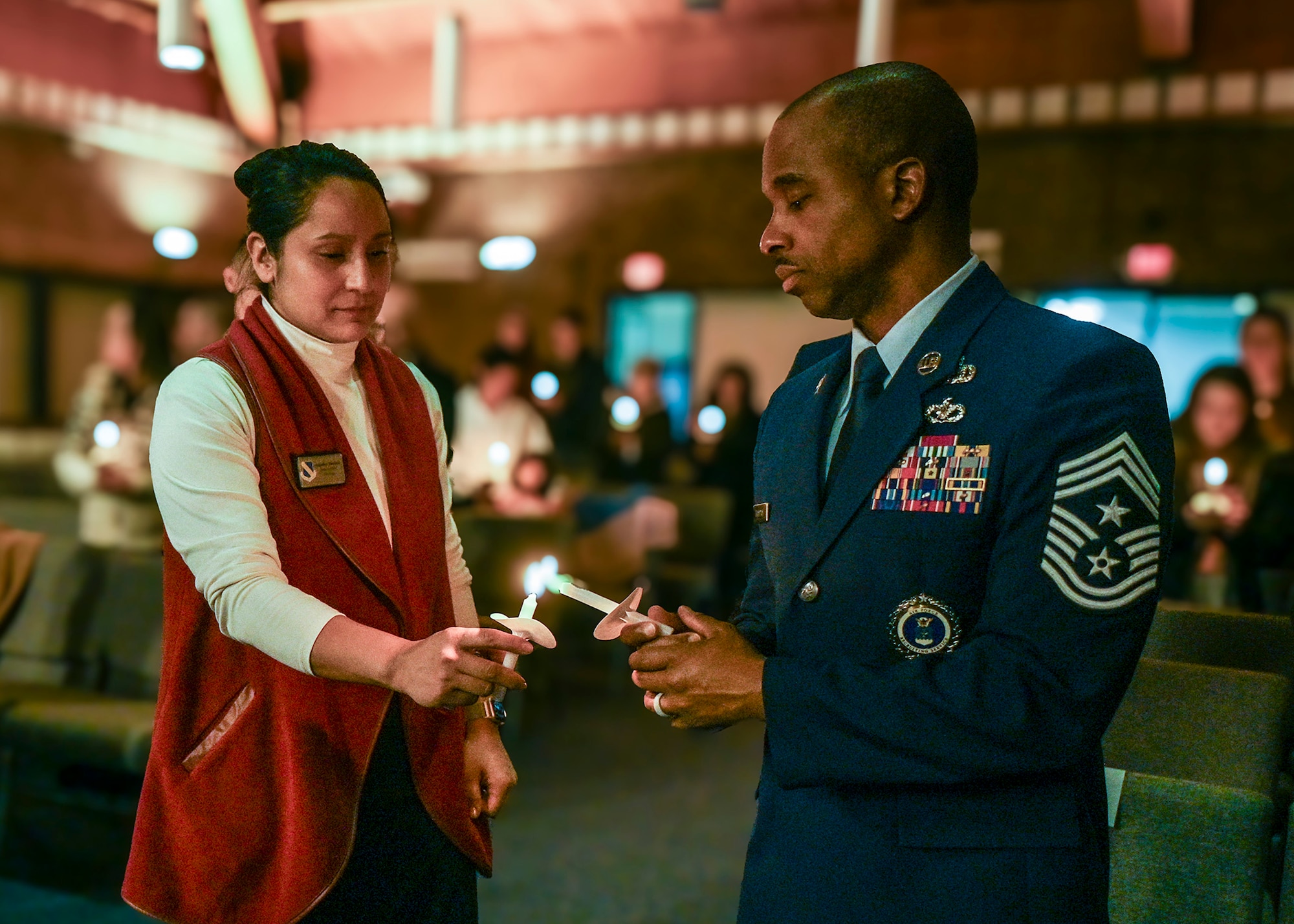 U.S. Air Force Chief Master Sgt. Anthony Thompson Jr., right, senior enlisted leader for Joint Base Anacostia-Bolling and 11th Wing command chief, and Angelina Morlock, left, a protocol specialist with the 11th WG, light a candle to honor the victims of the 2025 Potomac River aircraft collision during a remembrance ceremony at JBAB, Washington,

D.C., Jan. 29, 2026. Sixty-seven people were killed when American Airlines Flight 5342 and a U.S. Army UH-60L helicopter collided near Ronald Reagan Washington National Airport in Arlington, Va., Jan. 29, 2025. The ceremony marked the one-year anniversary of the incident and concluded with a candlelight memorial for the victims. (U.S. Air Force photo by Airman 1st Class Shanel Toussaint)