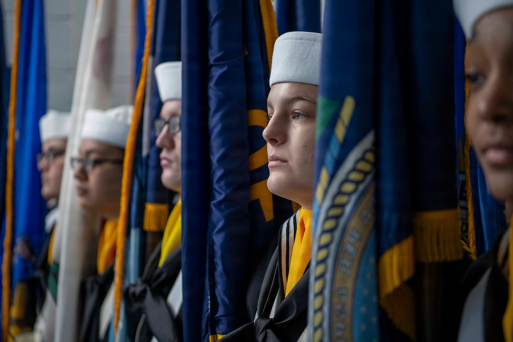 Recruits in the state flags unit await their pass-in-review at Recruit Training Command, Great Lakes. This nine-week training is the start for all U.S. Navy enlistees.
