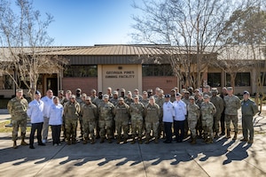U.S. Air Force 23d Wing leadership, airmen assigned to the 23d Force Support Squadron, and the Air Force Services Center Hennessy inspection team pose for a photo at Moody Air Force Base, Georgia, Jan. 27, 2025.