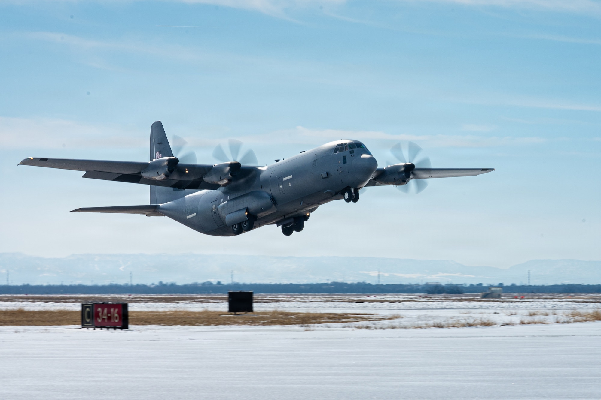 A U.S. Air Force C-130J Super Hercules assigned to the 317th Airlift Wing departs after the airfield reopened following Winter Storm Fern at Dyess Air Force Base, Texas, Jan. 28, 2026. The 7th Civil Engineer Squadron prioritized opening the airfield during the storm, using refitted and borrowed equipment to clear inches of snow over ice. Their removal efforts accelerated operational readiness timelines despite temperatures remaining below freezing during the days and nights of the removal process. (U.S. Air Force photo by Senior Airman Jade M. Caldwel