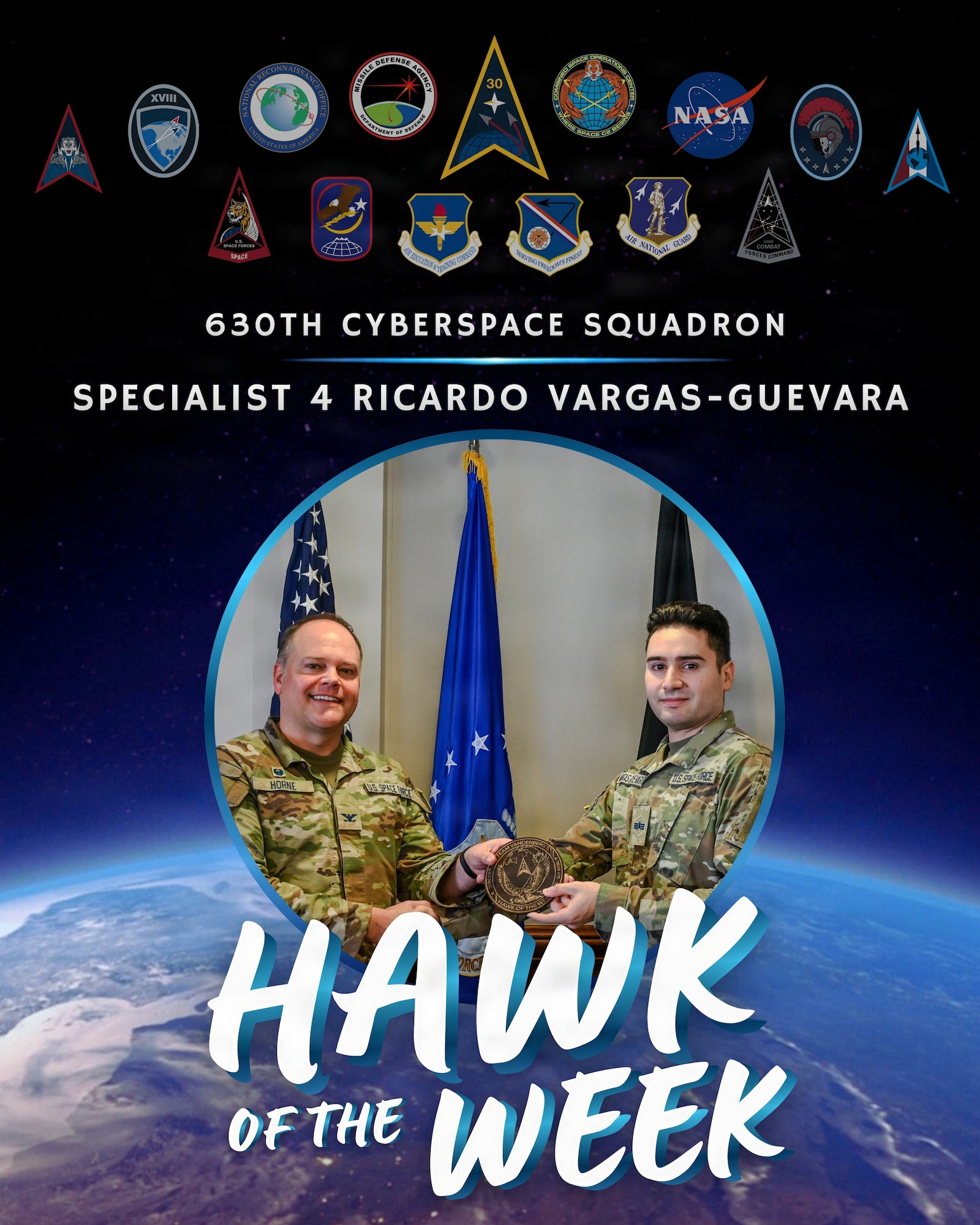 U.S. Space Force Col. James T. Horne III, left, Space Launch Delta 30 commander, presents Vandenberg’s Hawk of the Week Award to Specialist 4 Ricardo Vargas-Guevara, right, 630th Cyberspace Squadron cyber defense operator, during a weekly installation leadership meeting at Vandenberg Space Force Base, Calif., Feb. 4, 2026.