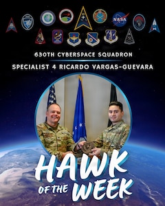 U.S. Space Force Col. James T. Horne III, left, Space Launch Delta 30 commander, presents Vandenberg’s Hawk of the Week Award to Specialist 4 Ricardo Vargas-Guevara, right, 630th Cyberspace Squadron cyber defense operator, during a weekly installation leadership meeting at Vandenberg Space Force Base, Calif., Feb. 4, 2026.