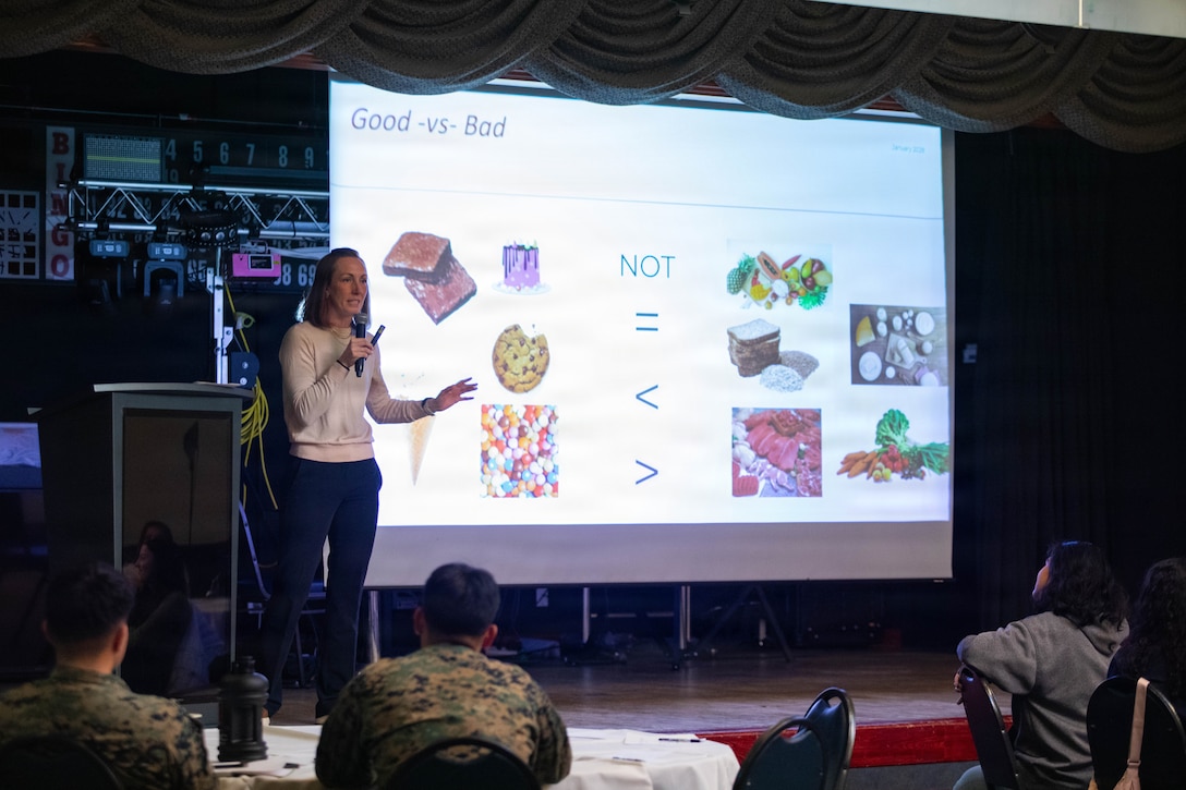 Brittney Rigdon, a nutritionist, and a native of Phoenix, Arizona, speaks to an audience during a Women in Service Symposium at Marine Corps Air Station Iwakuni, Japan, Jan. 30, 2026. The symposium focused on the physical and mental health and well-being of women in the service through discussions and presentations. (U.S. Marine Corps photo by Lance Cpl. Siwan Lewis)