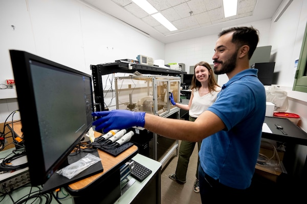 Harrison Cole (right), U.S. Naval Research Laboratory (NRL) intern, looks at images of neurons taken with an inverted microscope with Margaret Stevens, Ph.D., NRL electrical engineer, in Washington, D.C., Aug. 8, 2025. Cole participated in NRL’s Science and Engineering Apprentice Program where students work alongside researchers, attend program seminars, and deliver research presentations while exploring careers in science and technology. (U.S. Navy photo by Jonathan Steffen-Arnold)
