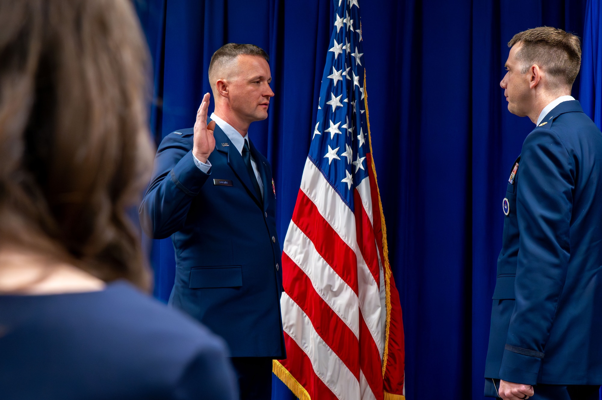 U.S. Air Force Chief Warrant Officer 5, Jason Godwin, left, Warrant Officer Training School advisor to the commandant, takes the oath of office from Maj. Tanner Allshouse, right, WOTS commandant, at a transfer of service ceremony at Maxwell Air Force Base, Alabama, Jan. 30, 2026. Godwin is the first Airman to achieve the rank of CW5 on active duty since the U.S. Air Force reintroduced the Warrant Officer corps to enhance technical leadership in critical career fields. (U.S. Air Force photo by Airman 1st Class Nelvis Sera)