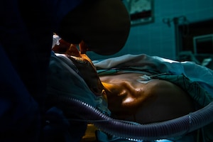 U.S. Army Capt. Michelle Tran, Landstuhl Medical Command circulator, disinfects a patient with antiseptic at Landstuhl Regional Medical Center, Germany, Jan. 29, 2026.