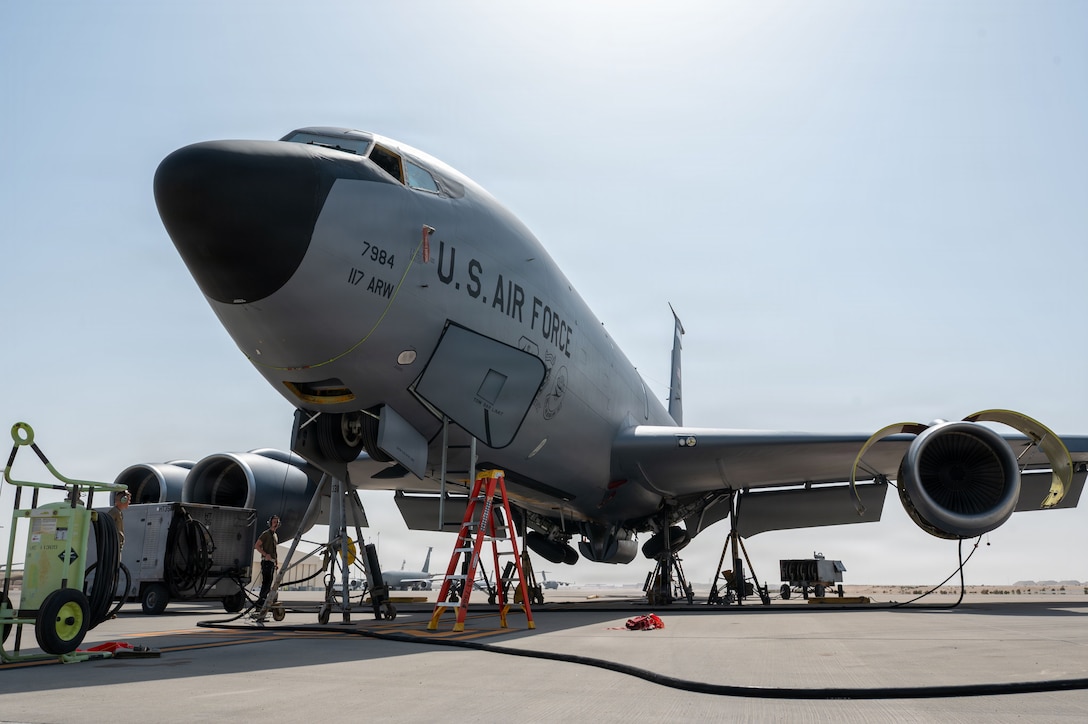 U.S. Airmen assigned to the 379th Expeditionary Maintenance Squadron electric and environmental systems shop conduct a landing gear swing for a KC-135 Stratotanker aircraft in the U.S. Central Command area of responsibility, Feb. 4, 2026. Landing gear swings allow maintainers to test the retraction and extension of landing gear to troubleshoot and repair relevant components.  (U.S. Air Force photo by Tech. Sgt. Kristen Pittman)
