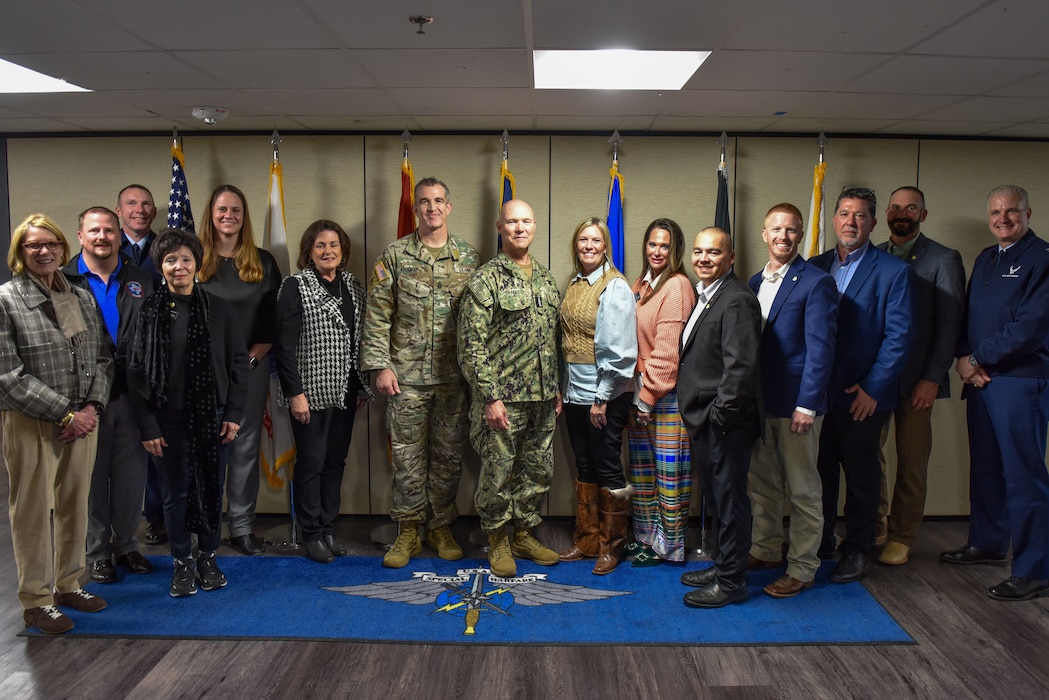 The 17th training wing commanders stand in a group photo with other leadership