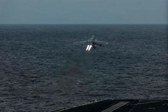 An F/A-18E Super Hornet, attached to Strike Fighter Squadron (VFA) 14, launches from the flight deck of Nimitz-class aircraft carrier USS Abraham Lincoln (CVN 72) in the Arabian Sea, Feb. 3, 2026. Abraham Lincoln is deployed to the U.S. 5th Fleet area of operations to support maritime security and stability in the U.S. Central Command area of responsibility. (U.S. Navy photo by Mass Communication Specialist Seaman Zoe Simpson)