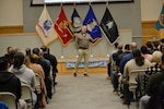 Deputy Commander of DLA Troop Support talks with new hires during a town hall meeting Feb 4