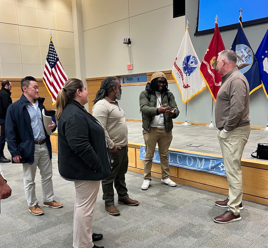 Deputy Commander of DLA Troop Support talks with new hires after town hall meeting Feb 4