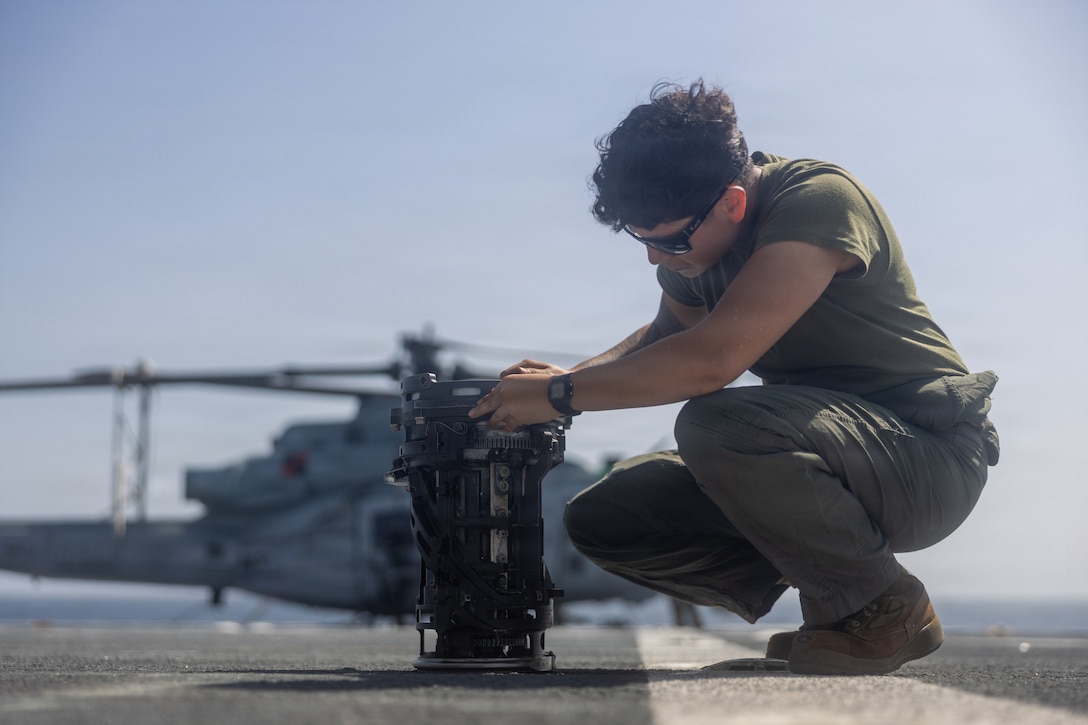 A U.S. Marine with Marine Medium Tiltrotor Squadron (VMM) 263 (Reinforced), 22nd Marine Expeditionary Unit (Special Operations Capable), conducts intermediate level maintenance on an M197 20mm automatic gatling gun aboard the San Antonio-class amphibious transport dock USS Fort Lauderdale (LPD 28), while underway in the Caribbean Sea, Feb. 1, 2026. U.S. military forces are deployed to the Caribbean in support of the U.S. Southern Command mission, Department of War-directed operations, and the president’s priorities to disrupt illicit drug trafficking and protect the homeland. (U.S. Marine Corps photo)