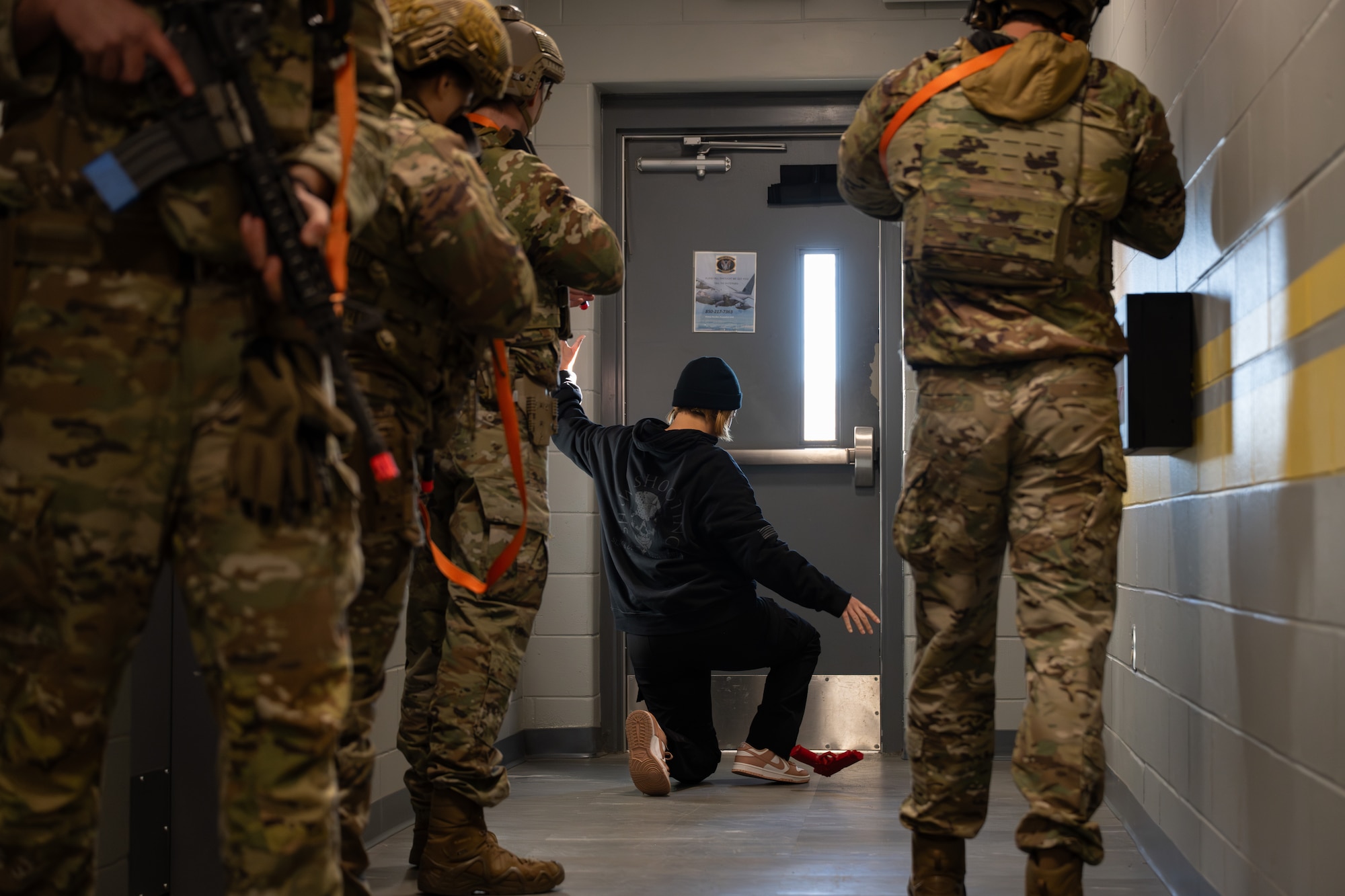 Security Forces Airmen assigned to the 1st Special Operations Wing give commands to a volunteer roleplaying as a suspect during an active-shooter exercise at Hurlburt Field, Florida, Jan. 28, 2026.