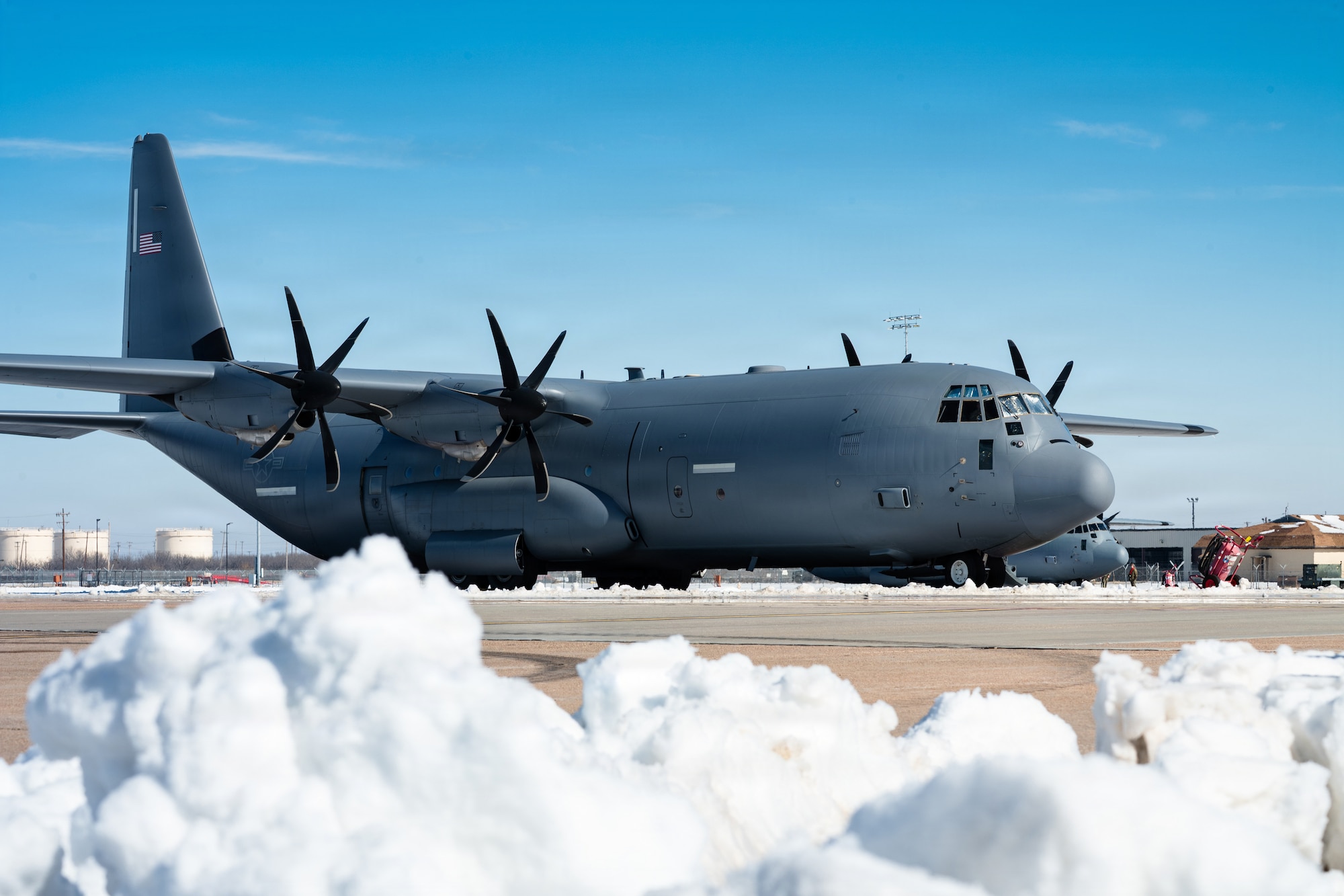 A U.S. Air Force C-130J Super Hercules assigned to the 317th Airlift Wing is parked on the flightline at Dyess Air Force Base, Texas, Jan. 28, 2026. The 7th Civil Engineer Squadron reopened the airfield quickly following Winter Storm Fern without organic snow removal equipment, relying on adapted and rented construction machinery. (U.S. Air Force photo by Senior Airman Jade M. Caldwell)