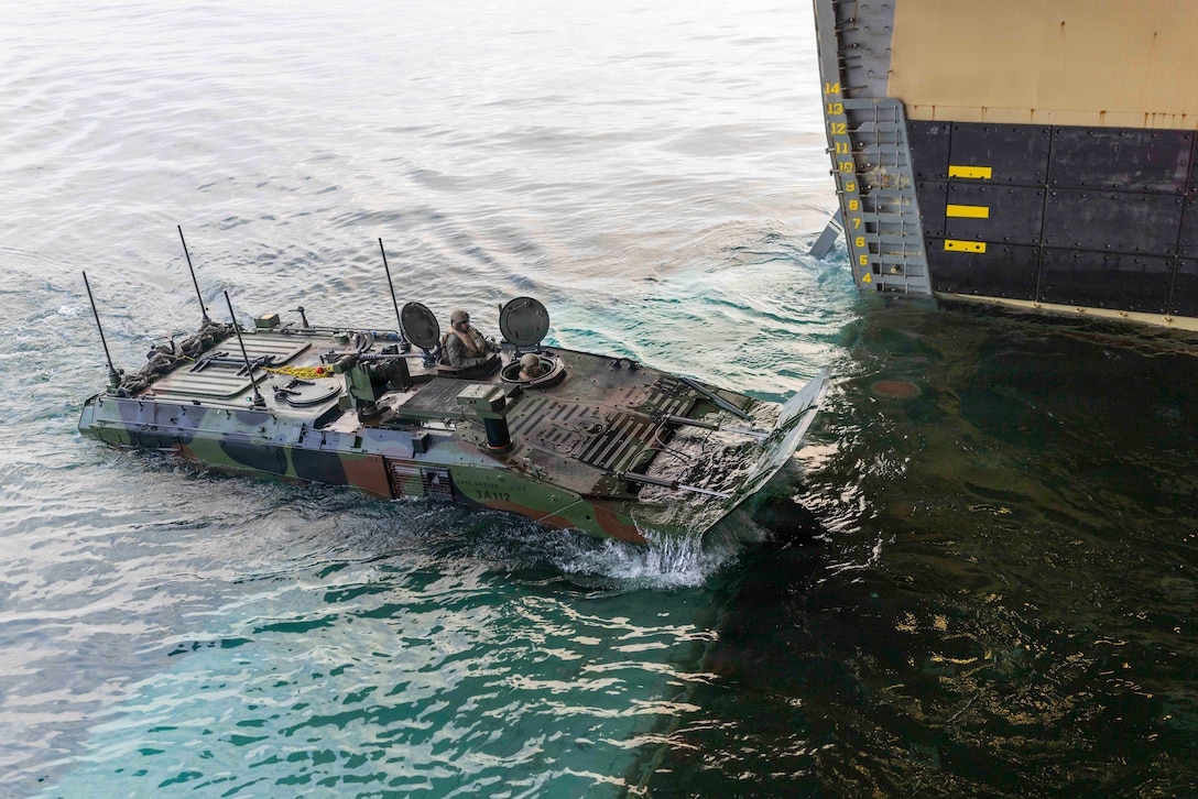 U.S. Marines with 3rd Assault Amphibian Battalion, 1st Marine Division, embark an Amphibious Combat Vehicle onto Wasp-class amphibious assault ship USS Makin Island (LHD 8), during Quarterly Underway Amphibious Readiness Training 26.2, off the coast of California, Jan. 23, 2026.