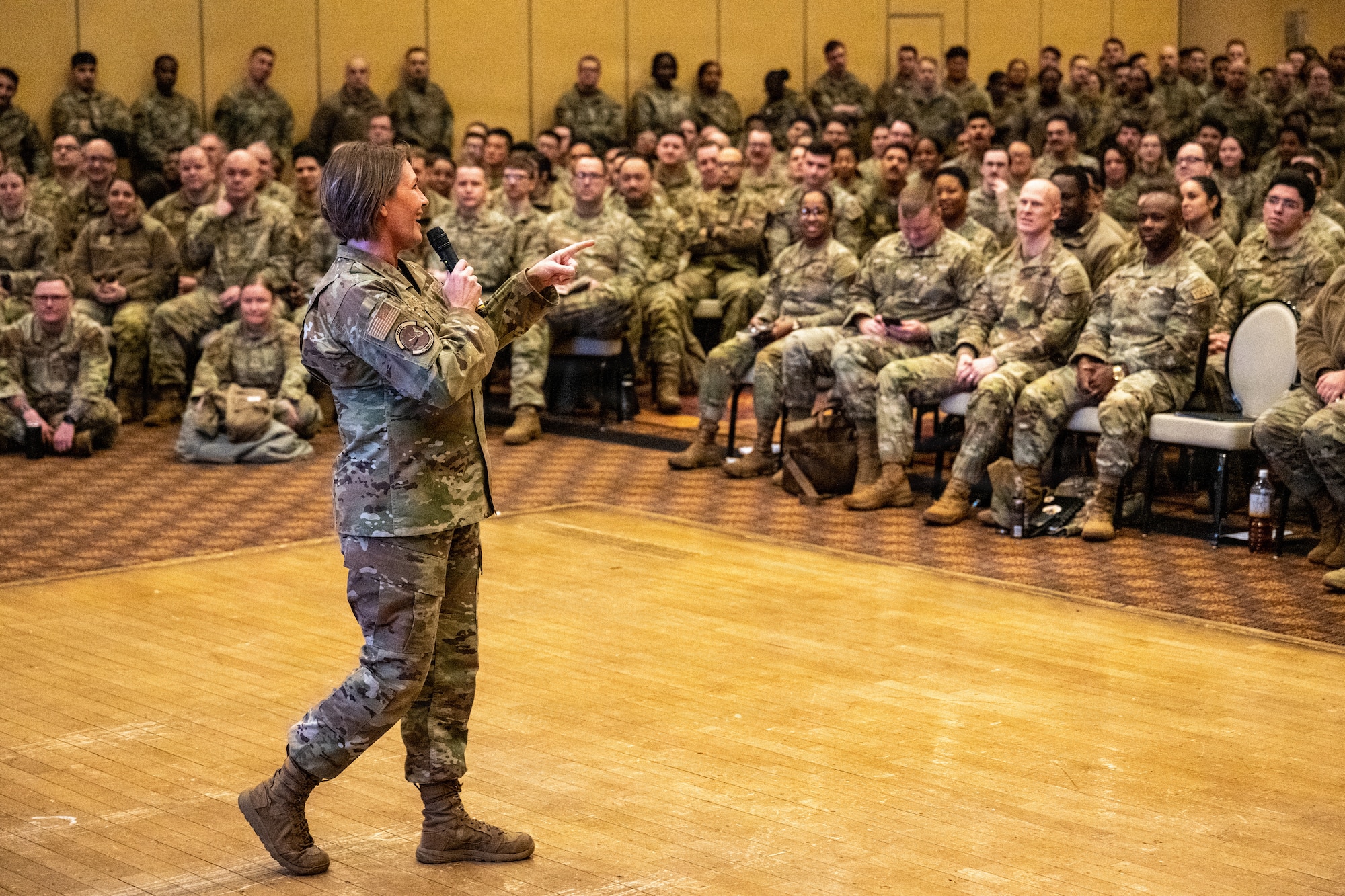 U.S. Air Force Chief Master Sgt. Kathleen McCool, Pacific Air Forces command chief, addresses airmen during an all call at Misawa Air Base, Japan.