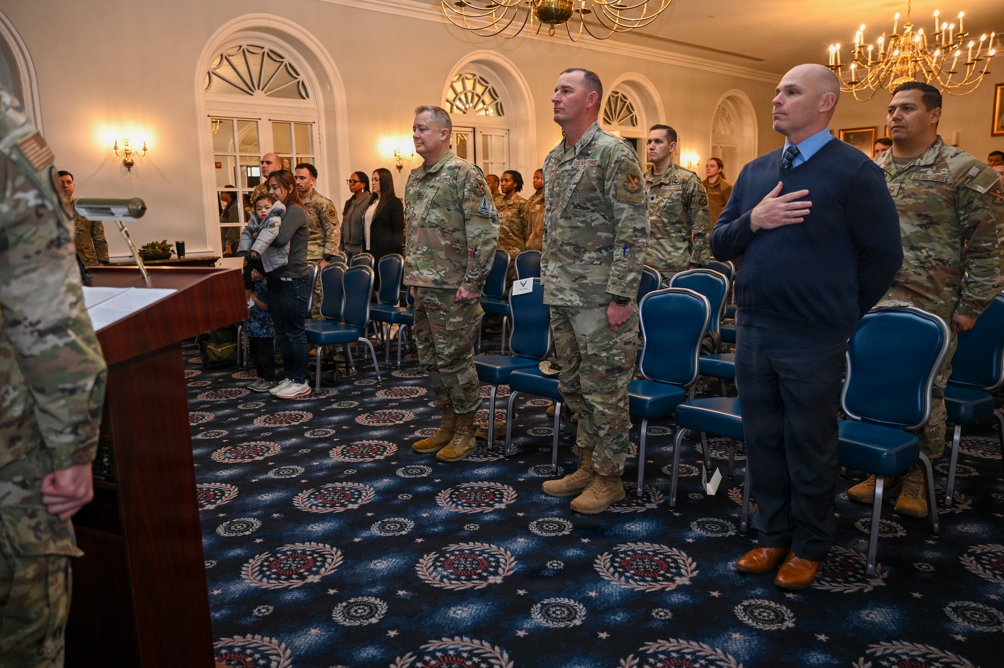 Attendees stand for the playing of “The Star-Spangled Banner” during the 11th Contracting Squadron assumption of command ceremony at Joint Base Anacostia-Bolling, Washington, D.C., Jan. 23, 2026. Established in 2020 with the lead service transfer of JBAB from the U.S. Navy to the Air Force and the activation of the 11th Wing, the 11th CONS manages purchasing and acquisition processes on JBAB. (U.S. Air Force photo by Airman 1st Class Shanel Toussaint)