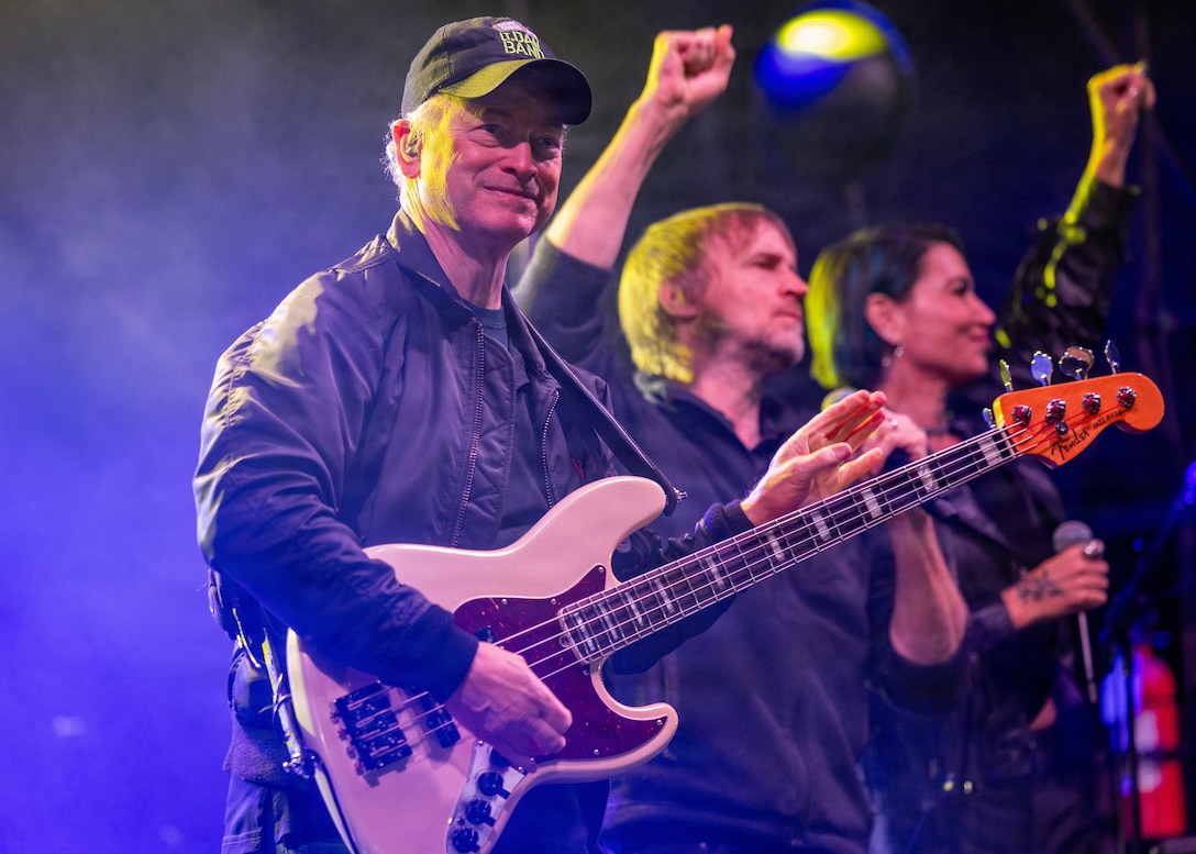Gary Sinise, actor and philanthropist, plays a bass guitar with the Lt. Dan Band during the Marine Corps Community Services Camp Pendleton Winter Carnival at Marine Corps Base Camp Pendleton, Calif., Jan. 30, 2026. The event featured live music, carnival games and food trucks to bring the community together and celebrate the winter season. (U.S. Marine Corps photo by Lance Cpl. Sherchand)
