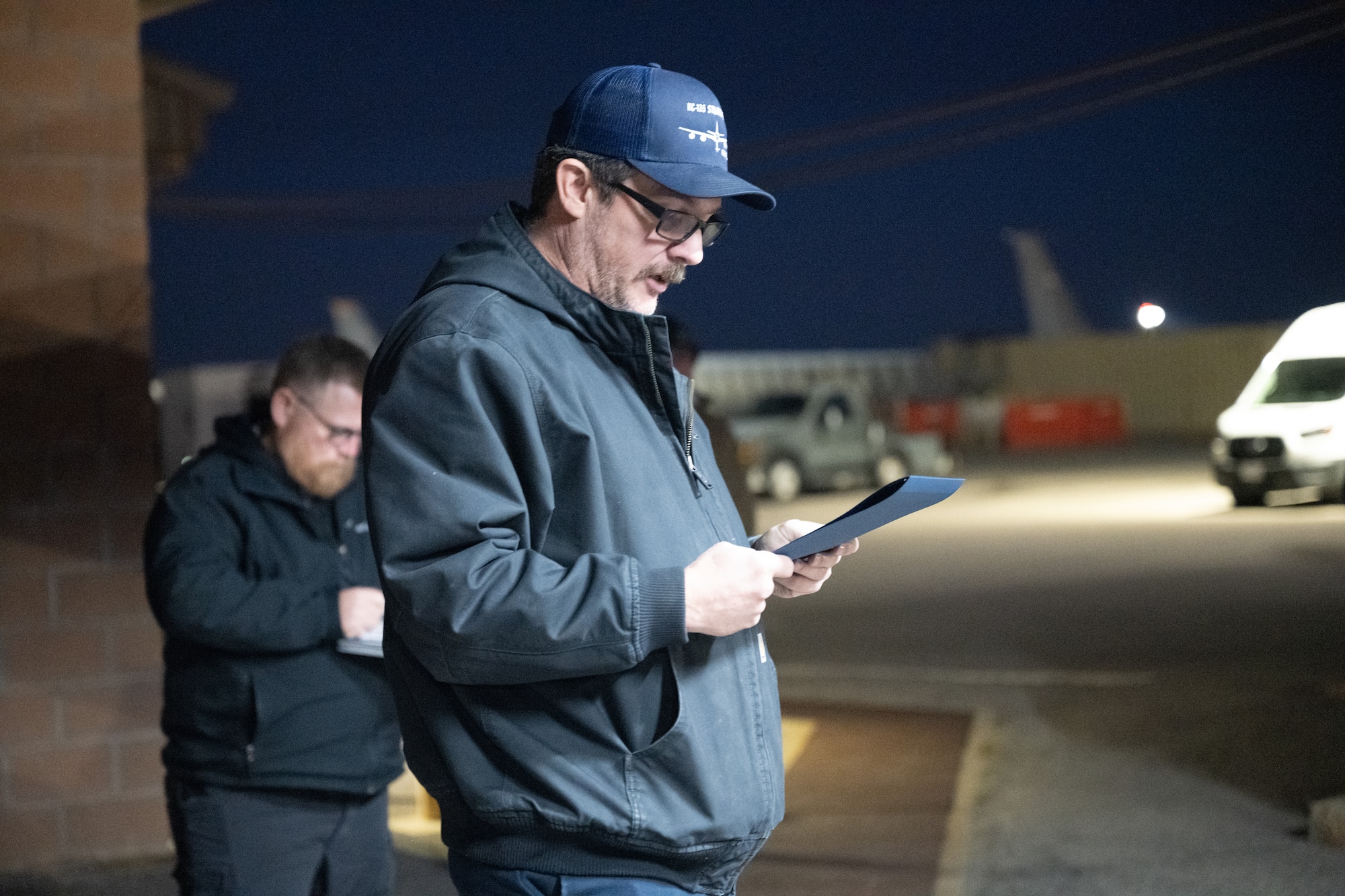 Charles Goodwin, U.S. Air Force 97th Aircraft Maintenance Squadron flight chief, announces the Knuckle Buster award winners at Altus Air Force Base, Oklahoma, Jan. 22, 2026. The Knuckle Buster awards were given out to several maintainers for their work on repairing a damaged trunnion on a KC-135 Stratotanker aircraft. (U.S. Air Force photo by Airman 1st Class Nathan Langston)