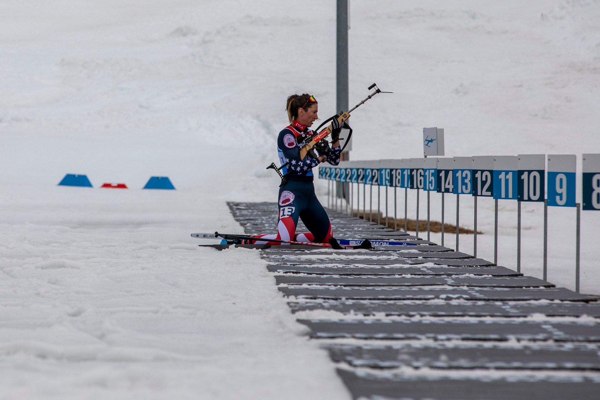 U.S. Army Sgt. Deedra Irwin, 86th Troop Command, Vermont National Guard, prepares her rifle as she enters the shoot of a biathlon race at the Goms Nordic Center, in Geschinen, Switzerland, on Mar. 25, 2025. Sgt. Irwin raced in multiple events during her time at the CISM 2025 World Winter Military Games hosted by Switzerland. (U.S. Army National Guard photo by Sgt. Denis Nunez)