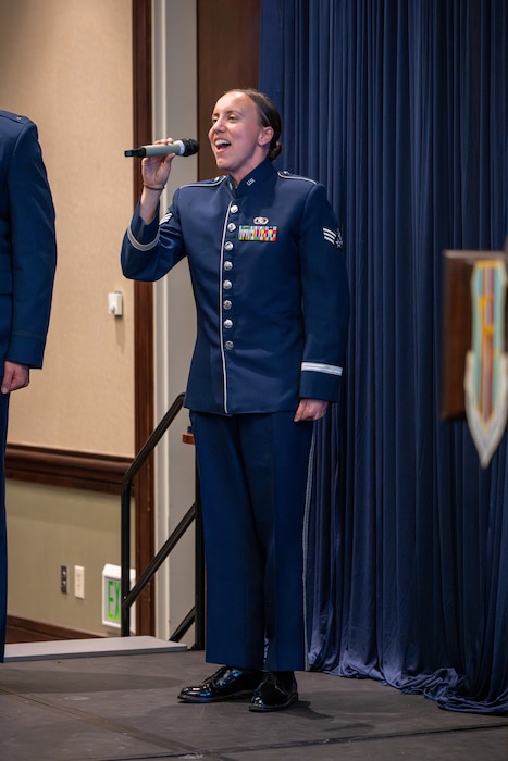 Airman sings National Anthem during ceremony