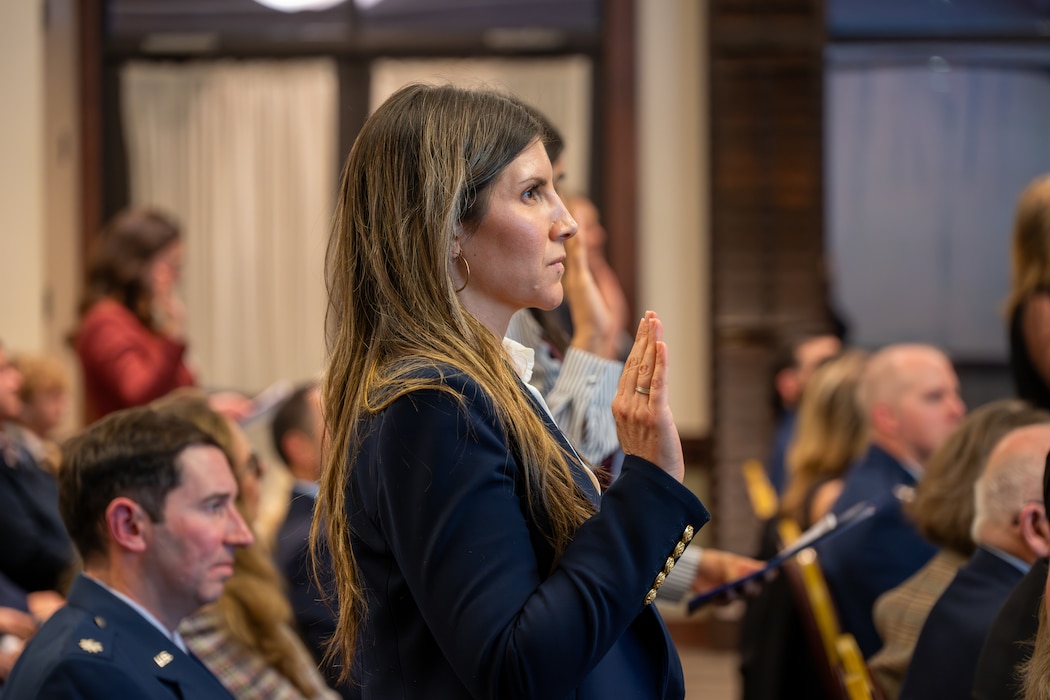 Woman recites pledge during ceremony