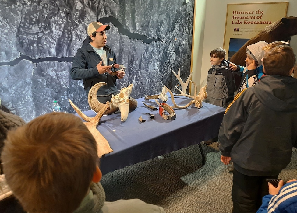 Photo of Montana State Fish, Wildlife and Parks Biologist Sam Martinez teaching a group of elementary school-aged students about 'hooves, horns and hides' during Friends of Scotchman Peaks Wilderness (FSPW) 12th annual “Winter Tracks” event, Jan. 23, 2026 and Jan. 29, 2026, at Libby Dam, Libby, Montana. The annual event teaches students about outdoor cooking, bear awareness, primitive fire making, how to track various animal signs and to identify native trees.