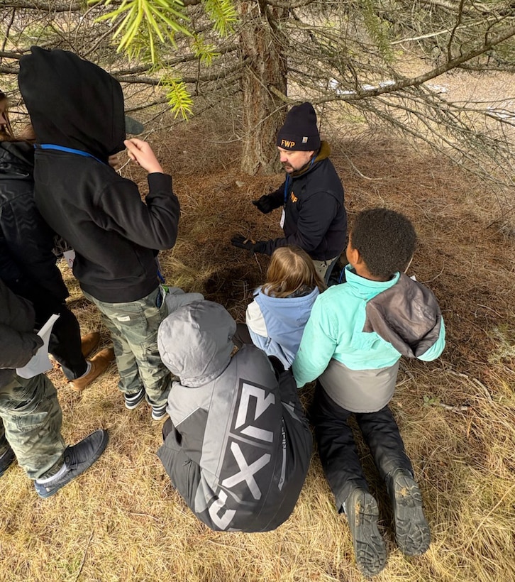 Photo of Montana State Fish, Wildlife and Parks Bear Biologist Garrett Tovey teaching a group of elementary school-aged students how to track and identify other animal signs, one of the various activity stations students rotated through during the Friends of Scotchman Peak’s 12th annual “Winter Tracks” event, Jan. 23, 2026 and Jan 29, 2026. Libby Dam, a U.S. Army Corps of Engineers' operating project in Libby, Montana, hosted this year's event.