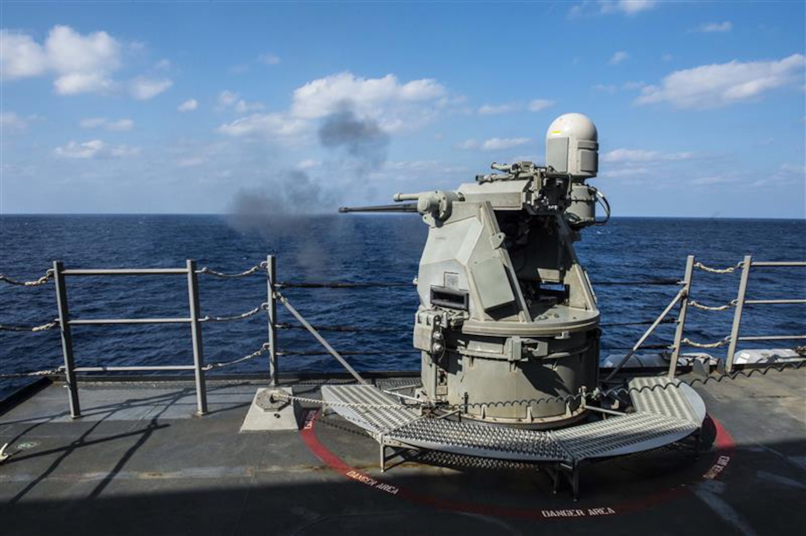 SOUTH CHINA SEA - Arleigh Burke-class guided-missile destroyer USS Mustin (DDG 89) fires its MK 38 25 mm gun during a live-fire drill in 2015. The weapon has since been upgraded to MK 38 MOD 4, which employes a 30 mm gun and integrates with the Aegis Combat System. (U.S. Navy photo by Mass Communication Specialist Seaman David Flewellyn/Released)