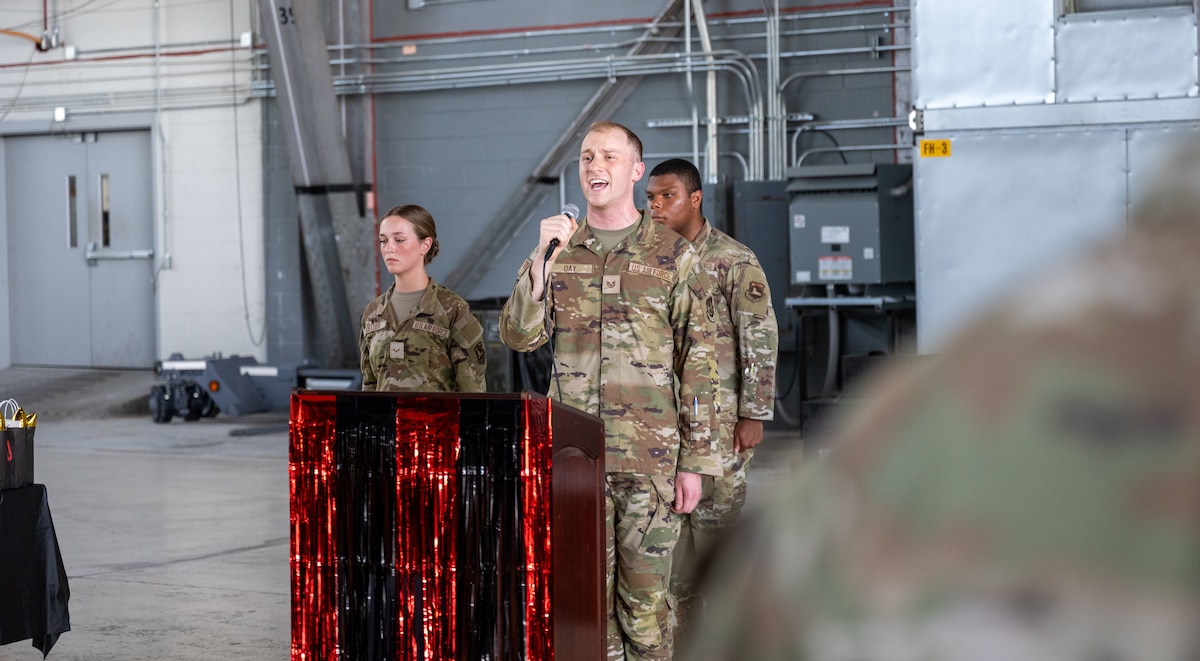 Staff Sgt. Robert Day, 88th Comptroller Squadron sings the National Anthem during the Technical Sergeant release party. (U.S. Air Force photo by Jack Gardner)