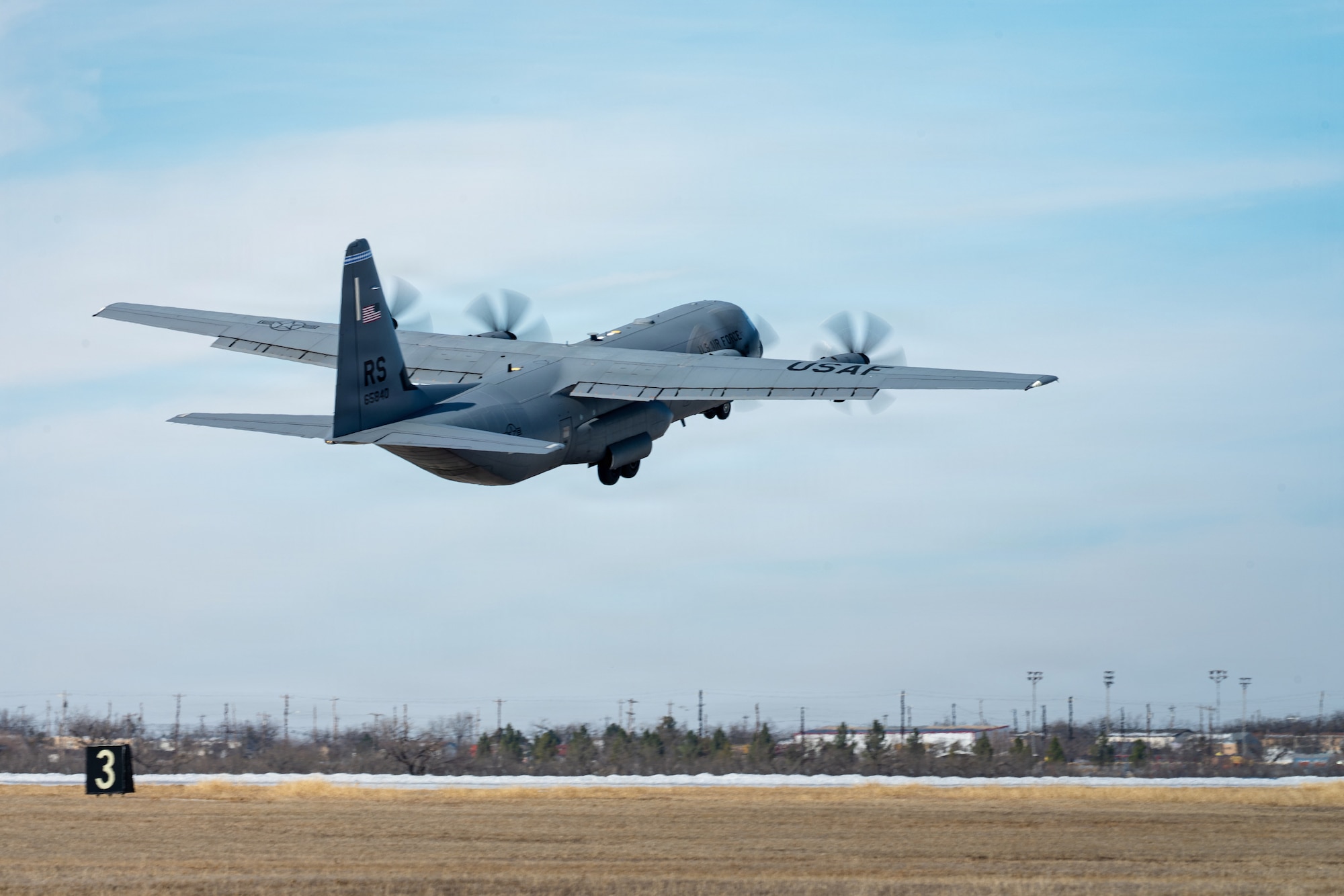 A U.S. Air Force C-130J Super Hercules departs after the airfield reopened following Winter Storm Fern at Dyess Air Force Base, Texas, Jan. 28, 2026. The 7th Civil Engineer Squadron accelerated airfield recovery timelines despite sustained below-freezing temperatures during winter storm recovery operations. (U.S. Air Force photo by Senior Airman Jade M. Caldwell)