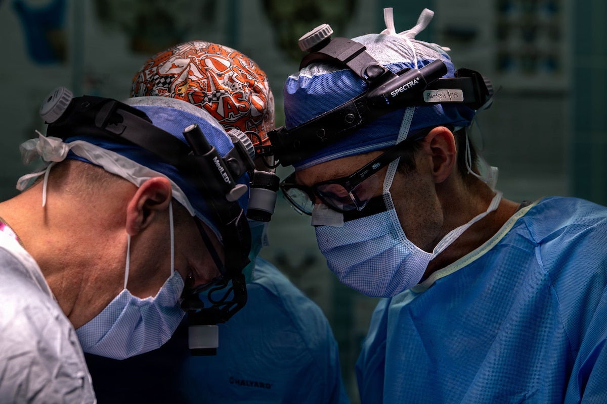 U.S. Air Force Maj. Matthew Van Hoof, right, 86th Dental Squadron oral and maxillofacial surgeon and Lt. Col. Matthew Wilson, 86th chief oral and maxillofacial surgeon, administers surgical treatment on a patient at Landstuhl Regional Medical Center, Germany, Jan. 29, 2026.