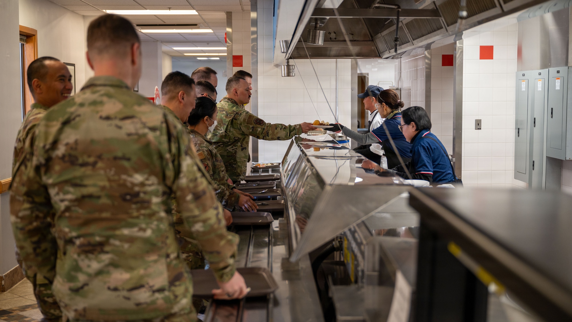 U.S. Air Force Airmen enjoy a meal together at the Pacific House Dining Facility at Osan Air Base, Republic of Korea, Jan. 30, 2026. The facility’s legacy reflects Osan’s long standing role in supporting readiness and sustaining the force. (U.S. Air Force photo by Senior Airman Rome Bowermaster)