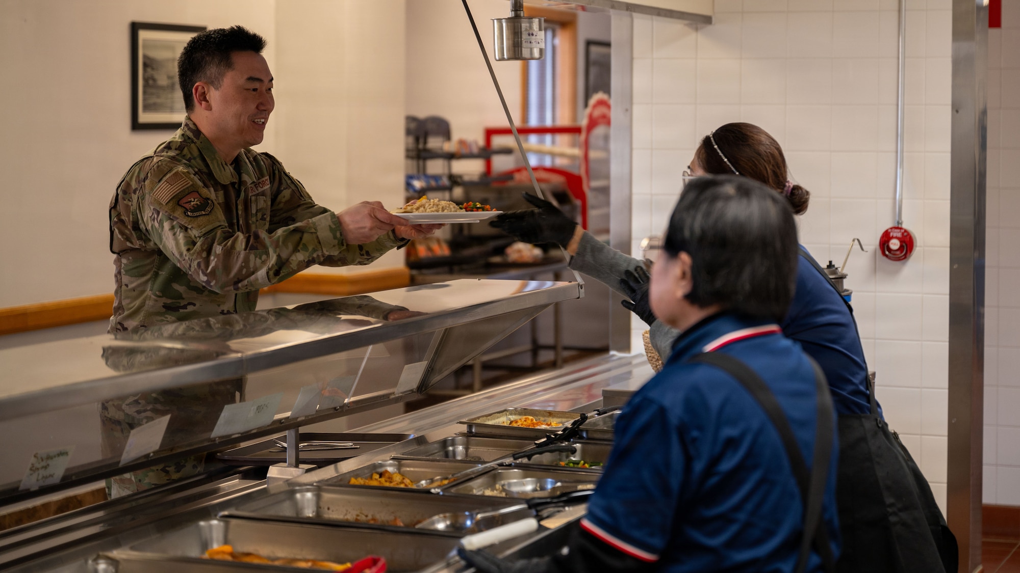 U.S. Air Force Capt. John Choi, 51st Fighter Wing chaplain, receives lunch at the Pacific House Dining Facility at Osan Air Base, Republic of Korea, Jan. 30, 2026. The final meal honored the legacy of the dining facility while highlighting Osan’s continued commitment to caring for its Airmen. (U.S. Air Force photo by Senior Airman Rome Bowermaster)