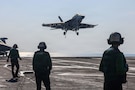 An F/A-18F Super Hornet, attached to Strike Fighter Squadron (VFA) 41, makes an arrested landing on the flight deck of Nimitz-class aircraft carrier USS Abraham Lincoln (CVN 72) in the Arabian Sea, Jan. 30, 2026. Abraham Lincoln is deployed to the U.S. 5th Fleet area of operations to support maritime security and stability in the U.S. Central Command area of responsibility. (U.S. Navy photo by Mass Communication Specialist Seaman Hannah Tross)