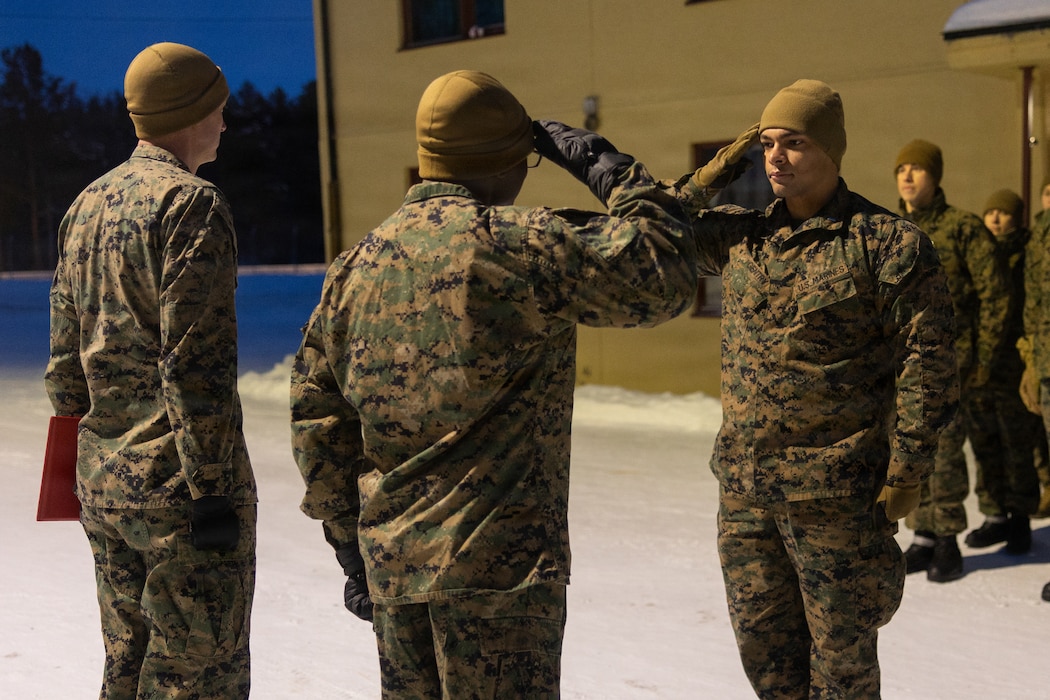 U.S. Marine Corps 1st Lt. Douglas Gentry, a logistics renders a salute to Lt. Col. Terry Whitaker, commanding officer of CLB-6, CLR-2, 2nd MLG, during a promotion ceremony in Setermoen, Norway, Feb. 1, 2026. Exercise Cold Response 26 is a Norwegian-led winter military exercise designed to enhance collective defense capabilities and ensure U.S. readiness to rapidly deploy and seamlessly operate alongside NATO Allies in challenging Arctic conditions. Gentry is a native of California. Whitaker is a native of Georgia. (U.S. Marine Corps photo by Cpl. Apollo Wilson)