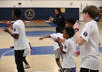Military dependents learn basketball drills during a Hoops for Troops youth basketball clinic hosted by the Washington Wizards at Joint Base Anacostia-Bolling, Washington, D.C., Jan. 23, 2026. The Wizards hosted the clinic for military families where children learned and improved on shooting, passing, dribbling, and defense techniques. (U.S. Air Force photo by Tech. Sgt. Sergio A. Gamboa)