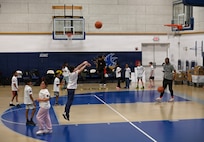 Military dependents participate in basketball shooting drills during a Hoops for Troops event at Joint Base Anacostia-Bolling, Washington, D.C., Jan. 23, 2026. The Washington Wizards hosted Hoops for Troops which is an NBA program that is dedicated to honoring service members, veterans and their families by supporting military communities. (U.S. Air Force photo by Tech. Sgt. Sergio A. Gamboa)