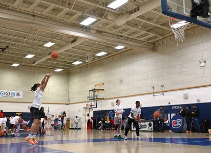 Military dependents participate in basketball shooting drills during a Hoops for Troops event at Joint Base Anacostia-Bolling, Washington, D.C., Jan. 23, 2026. The Washington Wizards hosted Hoops for Troops which is an NBA program that is dedicated to honoring service members, veterans and their families by supporting military communities. (U.S. Air Force photo by Tech. Sgt. Sergio A. Gamboa)