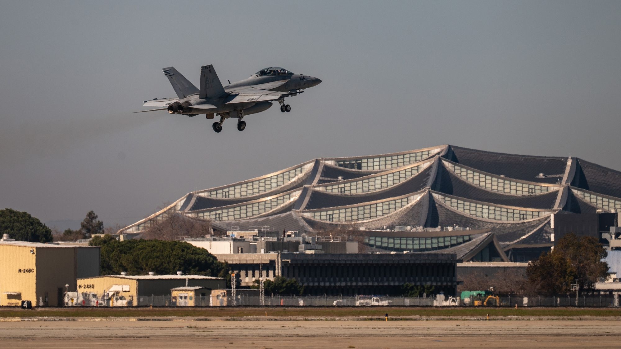 A U.S. Navy F/A-18E Super Hornet takes off from Moffett Air National Guard Base near Mountain View, Calif., Feb. 4., while flying a Bay Area elementary school teacher during a community engagement flight in the week leading to Super Bowl LX in nearby Santa Clara, Calif.