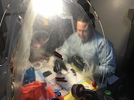 Lt. Cmdr. Elih M. Velazquez-Delgado, a biochemist assigned as the officer in charge for the Navy’s premier fly-away biowarfare agent detection laboratory in support of Chairman of the Joint Chiefs of Staff Priority-One Classified Mission, implementing cutting edge biosurveillance and detection capabilities within Navy operational forces, the National Guard Civil Support Teams, U.S. Marine Chemical and Biological Incident Response Forces and State Public Health Laboratories Incident Response at the Naval Medical Research Laboratory’s Biological Defense Research Directorate in Frederick Md., Mar. 7, 2018. (U.S. Navy photo)